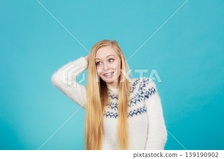 Happy woman showing her braces on teeth 139190902