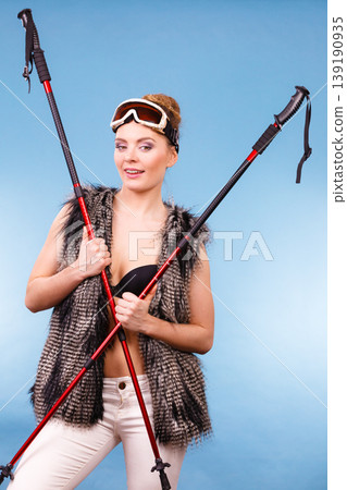 Winter season and lady with sticks. Winter season and lady with sticks. 139190935
