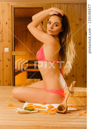 Sensual woman relaxing in sauna. Spa wellbeing. 139190977