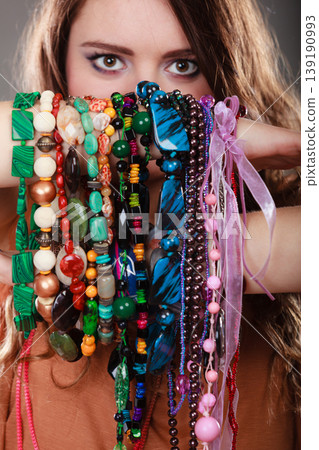 Pretty woman with jewelry necklaces bracelets 139190993