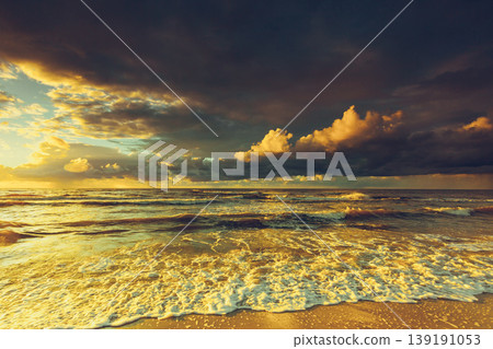 Beatiful sunset with clouds over sea and beach Beatiful sunset with clouds over sea and beach 139191053