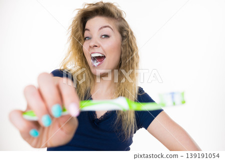 Woman brushing cleaning teeth Woman brushing cleaning teeth 139191054
