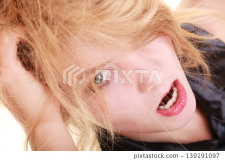 Angry furious woman screaming and pulling messy hair Angry furious woman screaming and pulling messy hair 139191097
