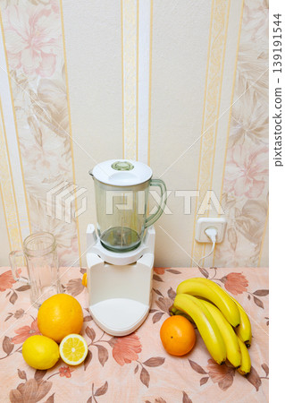 stationary blender with fruits on the table for making smoothies 139191544
