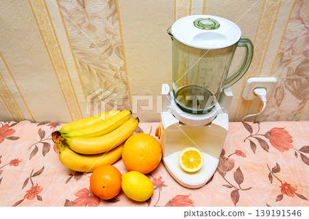 fruit set and a blender with a lemon slice on the stand fruit set and a blender with a lemon slice on the stand 139191546