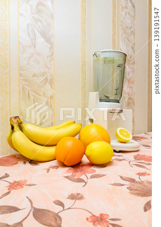 white stationary blender and fruits against light wallpaper white stationary blender and fruits against light wallpaper 139191547