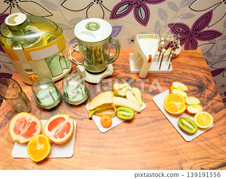 top view of kitchen appliances and sliced fruits on the table top view of kitchen appliances and sliced fruits on the table 139191556