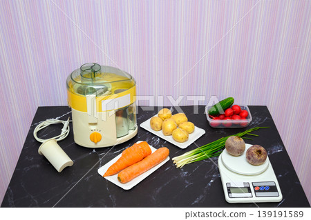 variety of fresh vegetables and kitchen appliances on the dark marble surface of the table variety of fresh vegetables and kitchen appliances on the dark marble surface of the table 139191589
