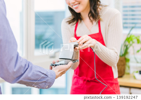 Cashless payment at the register 139192247