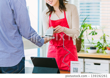 Cashless payment at the register Cashless payment at the register 139192261
