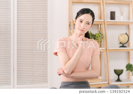 Women struggling with sportswear Women struggling with sportswear 139192524