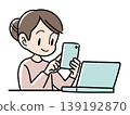 An illustration of the upper body of a woman smiling and using a smartphone in front of a laptop. An illustration of the upper body of a woman smiling and using a smartphone in front of a laptop. 139192870