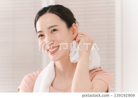 A woman sweating with a towel 139192909