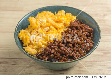 Two-color rice bowl with minced chicken and egg Two-color rice bowl with minced chicken and egg 139192948