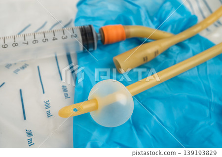 Foley urinary catheter with urine bag for disability or patient in hospital. Foley urinary catheter with urine bag for disability or patient in hospital. 139193829