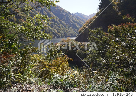 Lake Okutadami as seen from National Route 352 (Jukai Line) along the shore of Lake Okutadami, October 30, 2025. 139194246