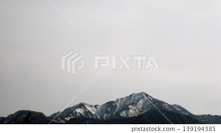 Mount Yoneyama with lingering snow Mount Yoneyama with lingering snow 139194385