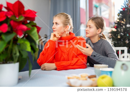 Upset mother turned away after quarrel with teenage daughter during Christmas celebration Upset mother turned away after quarrel with teenage daughter during Christmas celebration 139194578