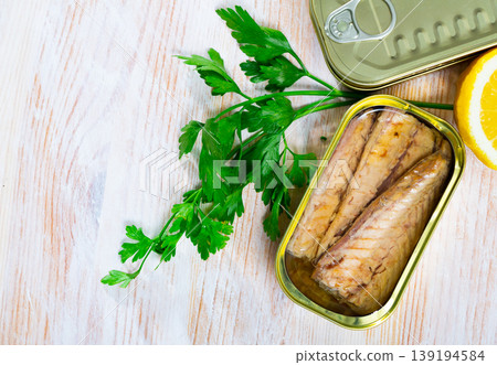 Salty fillet of mackerel in sunflower oil in open tin can Salty fillet of mackerel in sunflower oil in open tin can 139194584