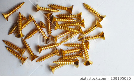 Stack of Gold Wood Screws on White Background Stack of Gold Wood Screws on White Background 139195050