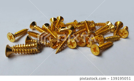 Stack of Gold Wood Screws on White Background Stack of Gold Wood Screws on White Background 139195051