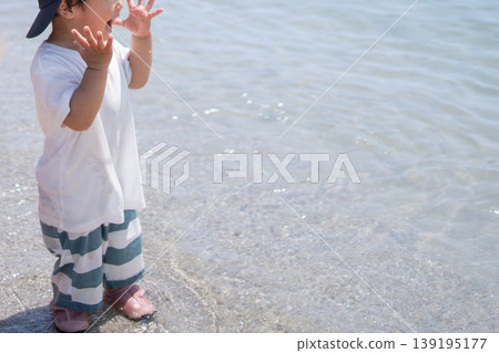 Children playing in the sea Children playing in the sea 139195177