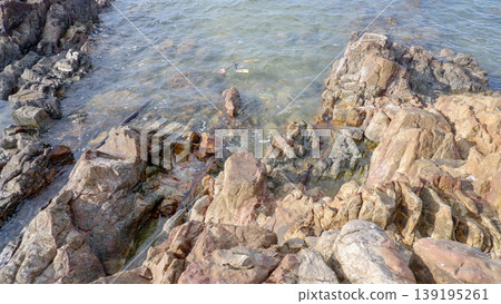 Clear Sea Water Flowing Over Coastal Rocks 139195261