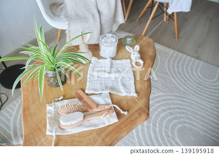 Organic baby care items and a plant arranged on a wooden table Organic baby care items and a plant arranged on a wooden table 139195918