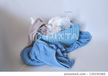 Basket containing baby care products and everyday items Basket containing baby care products and everyday items 139195960