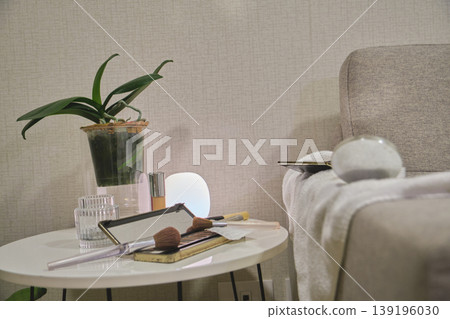 Wellness concept with makeup and plant on vanity table Wellness concept with makeup and plant on vanity table 139196030