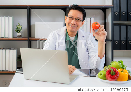 Portrait asian man nutritionist working in medical clinic office. 139196375