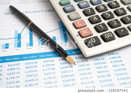 Calculator with pen on data business graphs paper. Calculator with pen on data business graphs paper. 139197541