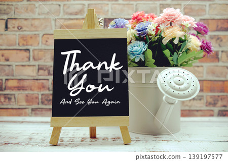 Thank You And See You Again text on black wooden easel and vase with flowers bouquet on brick wall background Thank You And See You Again text on black wooden easel and vase with flowers bouquet on brick wall background 139197577