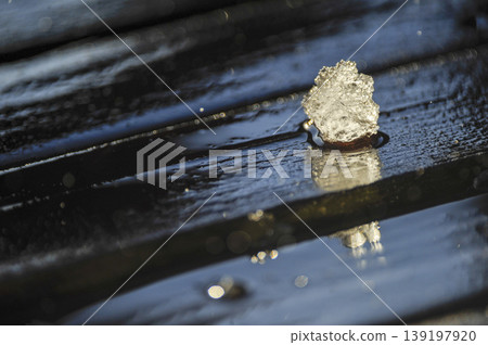 A symphony of ice and light on a rainy deck A symphony of ice and light on a rainy deck 139197920