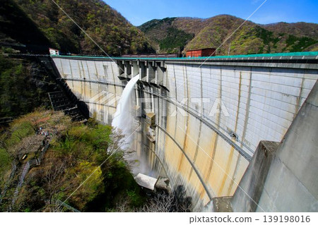 From the beautifully curved arch dam... Kawaji Dam during inspection discharge. From the beautifully curved arch dam... Kawaji Dam during inspection discharge. 139198016