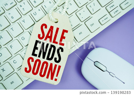Price tag with text "Sale Ends Soon!" and white keyboard and wireless mouse Price tag with text "Sale Ends Soon!" and white keyboard and wireless mouse 139198283