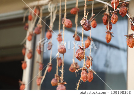 Dried persimmons swaying in the wind Dried persimmons swaying in the wind 139198398