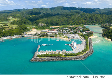 An aerial photograph taken in April of Teima Fishing Port in Nago City, Okinawa Prefecture, surrounded by emerald green sea. An aerial photograph taken in April of Teima Fishing Port in Nago City, Okinawa Prefecture, surrounded by emerald green sea. 139198599