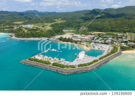 An aerial photograph taken in April of Teima Fishing Port in Nago City, Okinawa Prefecture, surrounded by emerald green sea. An aerial photograph taken in April of Teima Fishing Port in Nago City, Okinawa Prefecture, surrounded by emerald green sea. 139198600