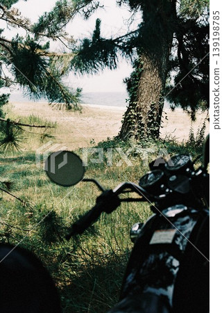 A view of the sea and a motorcycle A view of the sea and a motorcycle 139198785