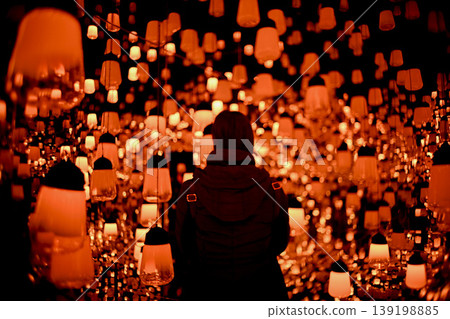 The fantastical light of lanterns and the silhouettes of people The fantastical light of lanterns and the silhouettes of people 139198885
