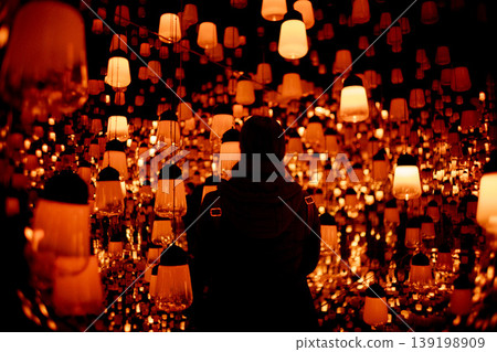 The fantastical light of lanterns and the silhouettes of people The fantastical light of lanterns and the silhouettes of people 139198909