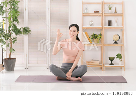 Female yoga instructor Female yoga instructor 139198993