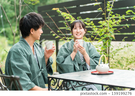 A couple in yukata drinking tea while enjoying forest bathing on a trip 139199276