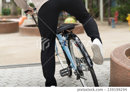 A man riding a bicycle - a social issue A man riding a bicycle - a social issue 139199294