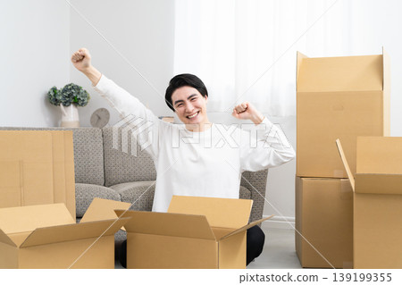 A young man preparing to move: Lifestyle image A young man preparing to move: Lifestyle image 139199355