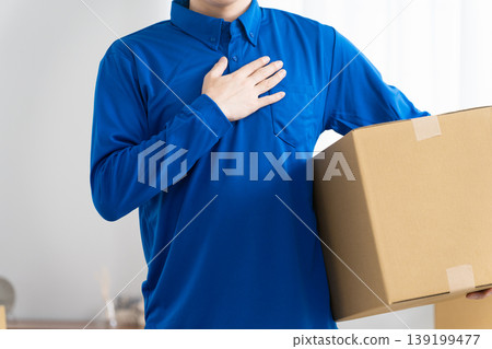 A young man working in the moving industry; lifestyle image 139199477