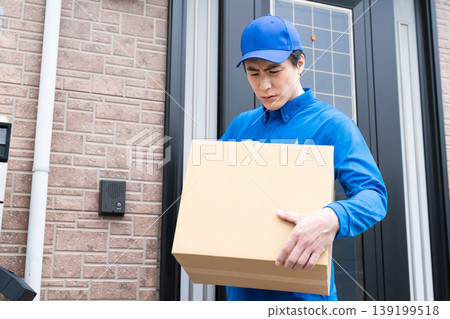 A young delivery person rings the doorbell - Lifestyle image A young delivery person rings the doorbell - Lifestyle image 139199518