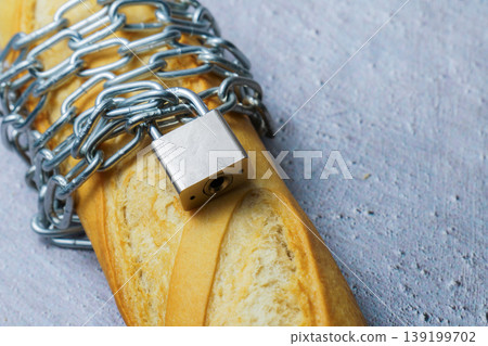 Baguette with chain and lock symbolizing restricted diet Baguette with chain and lock symbolizing restricted diet 139199702