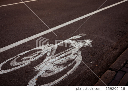 Dedicated bicycle lane painted on asphalt, sustainable urban transport, active lifestyle environmental consciousness and infrastructure markings theme Dedicated bicycle lane painted on asphalt, sustainable urban transport, active lifestyle environmental consciousness and infrastructure markings theme 139200416